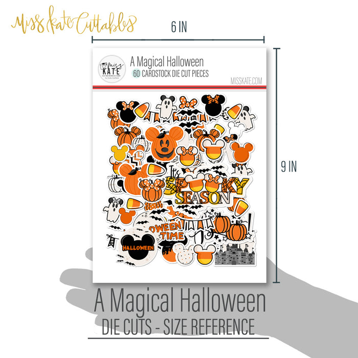 A Magical Halloween Die Cuts, size guide shown in hand for scale, showing pre-cut scrapbook embellishments for layouts, handmade cards, journals, mini albums, memory pages, and layered paper crafts. Buyer theme: Halloween Die Cuts & Theme Park Ephemera. A Magical Halloween die cuts with pumpkins, ghosts, candy corn, bats, spiderwebs, bows, mouse-ear silhouettes, castle art and Halloween phrases. Use the coordinating pieces to layer around photographs, journaling, titles, and paper details