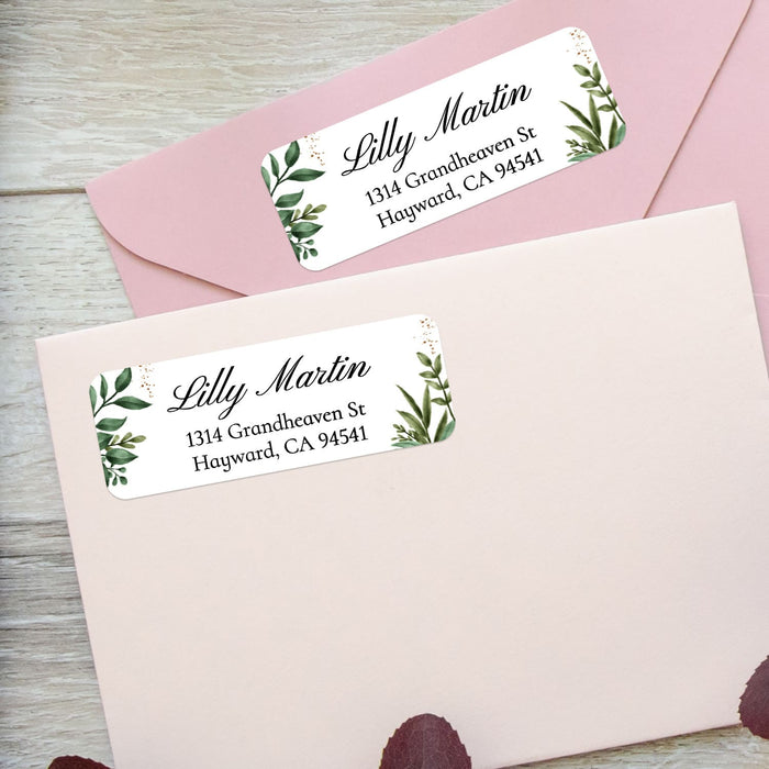 XOXOKristen custom greenery address labels on pastel pink envelopes, featuring watercolor leaves and modern script typography - XOXOKristen