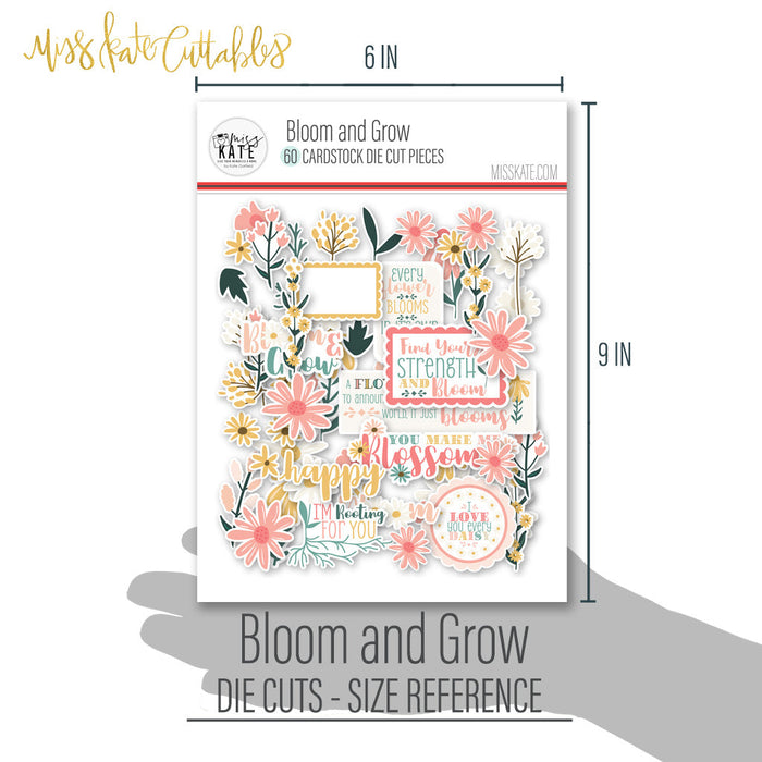 Bloom and Grow Die Cuts, size guide shown in hand for scale, showing pre-cut scrapbook embellishments for layouts, handmade cards, journals, mini albums, memory pages, and layered paper crafts. Buyer theme: Spring Floral Die Cuts & Garden Ephemera. Bloom and Grow die cuts with daisies, coneflowers, wildflower sprigs, botanical frames and uplifting floral title phrases. Color palette includes Coral pink, blush, peach, mustard gold, cream, sage, dusty teal, deep teal and warm taupe
