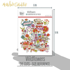 Wildflowers Die Cuts, size guide shown in hand for scale, showing pre-cut scrapbook embellishments for layouts, handmade cards, journals, mini albums, memory pages, and layered paper crafts. Buyer theme: Botanical Die Cuts & Floral Scrapbook Embellishments. Wildflowers Die Cuts with floral titles, daisies, coneflowers, strawberries, berry clusters, birds, butterfly, leaves, stems, bouquets and vintage banner accents